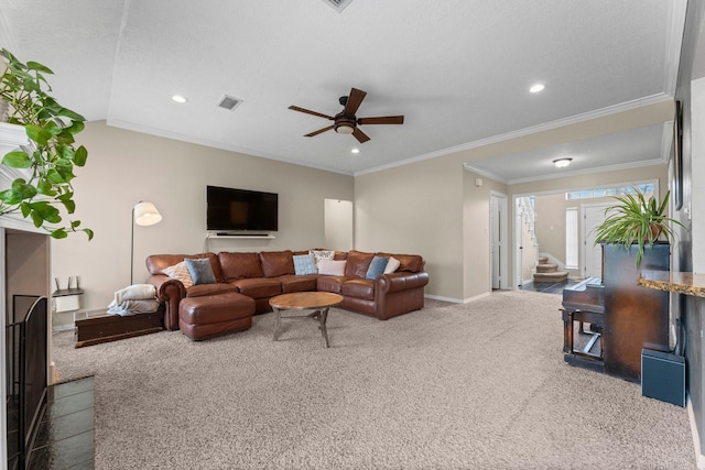 carpeted living room with stairs, visible vents, crown molding, and recessed lighting