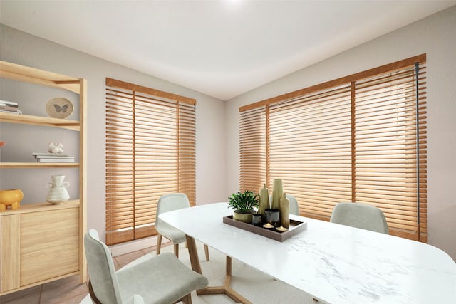 dining area with plenty of natural light and light tile patterned flooring