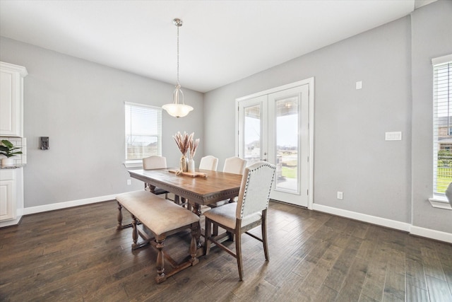 dining room with french doors, dark wood finished floors, and baseboards