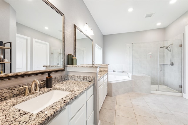 bathroom featuring tile patterned flooring, visible vents, vanity, a shower stall, and a bath