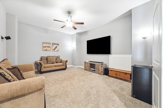 living room featuring carpet, a ceiling fan, and baseboards