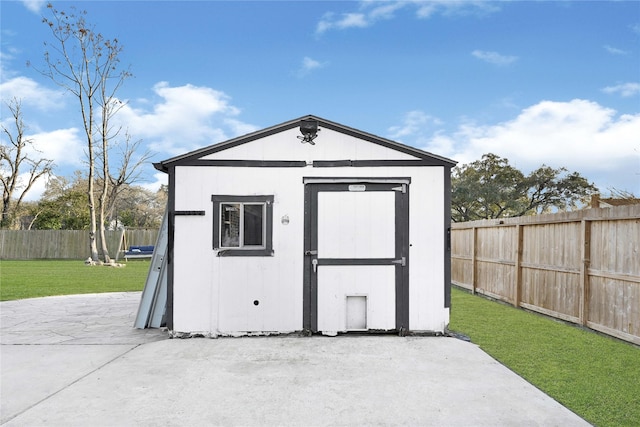 view of shed featuring a fenced backyard