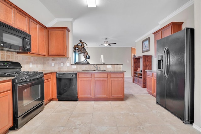 kitchen with tasteful backsplash, a peninsula, crown molding, black appliances, and a sink