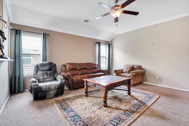 living room featuring baseboards, ornamental molding, visible vents, and light colored carpet