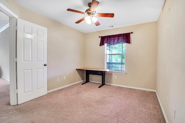 interior space featuring a ceiling fan, carpet, visible vents, and baseboards