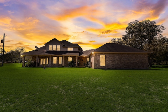 back of house featuring a yard