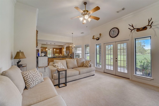 living room featuring french doors, visible vents, crown molding, and light carpet