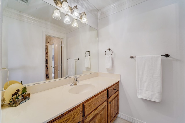 bathroom featuring baseboards, visible vents, crown molding, and vanity