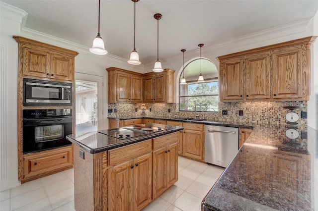 kitchen featuring a center island, crown molding, backsplash, a sink, and black appliances