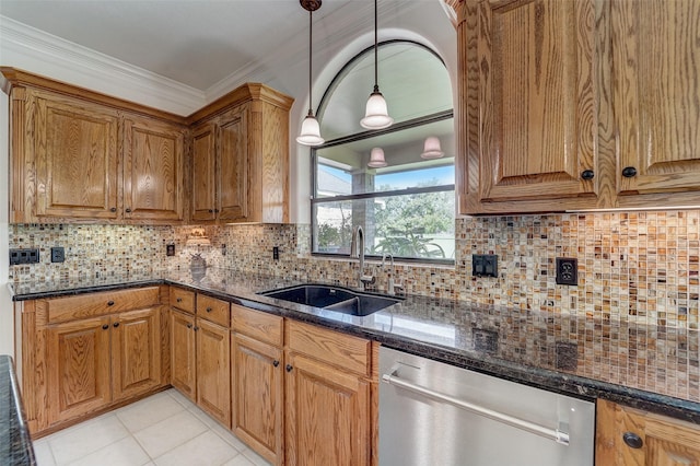 kitchen with decorative backsplash, stainless steel dishwasher, ornamental molding, a sink, and dark stone countertops