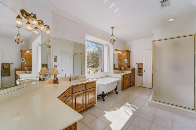 bathroom featuring crown molding, visible vents, a freestanding bath, an inviting chandelier, and a stall shower