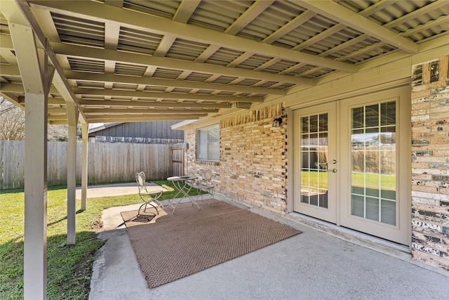 view of patio / terrace with french doors and fence