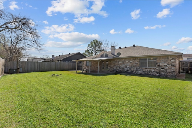 view of yard featuring a patio area and a fenced backyard