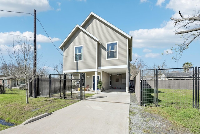 view of front of house featuring fence, driveway, a front yard, and a carport
