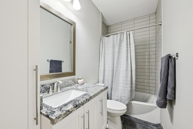 bathroom with vanity, shower / bath combo, and toilet