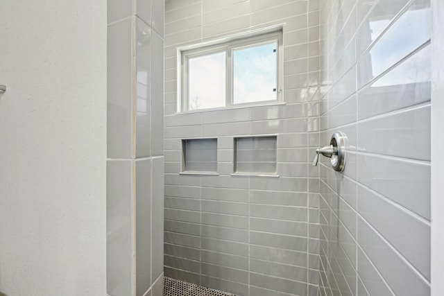 full bathroom with tiled shower