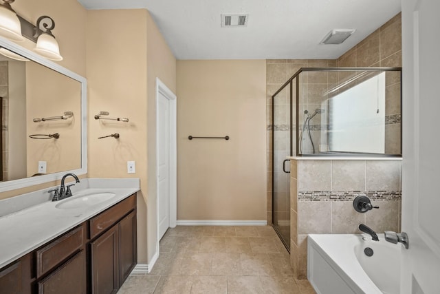 bathroom featuring vanity, visible vents, a shower stall, tile patterned floors, and a bathtub