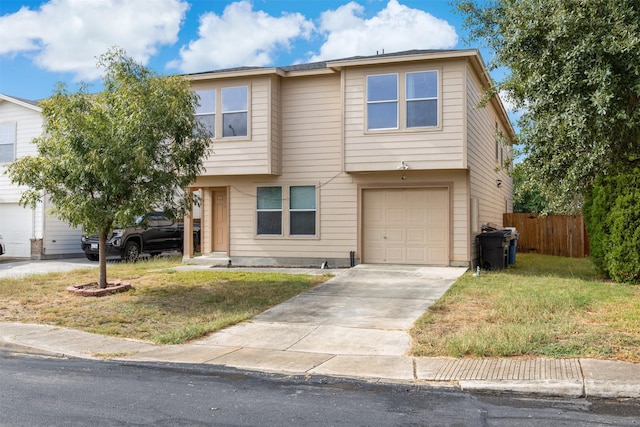 view of front facade with a garage, concrete driveway, a front lawn, and fence