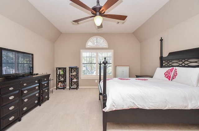 bedroom with light carpet, a ceiling fan, baseboards, and vaulted ceiling