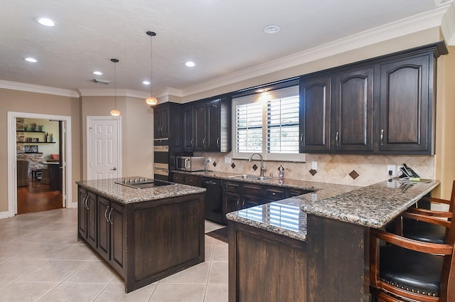 kitchen featuring black appliances, light stone counters, light tile patterned floors, and a sink