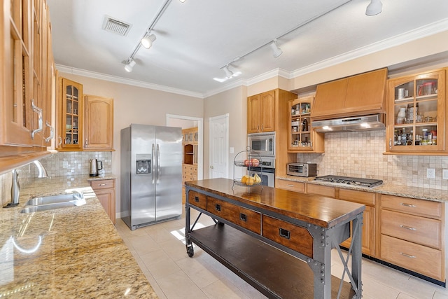 kitchen featuring a toaster, visible vents, appliances with stainless steel finishes, glass insert cabinets, and under cabinet range hood