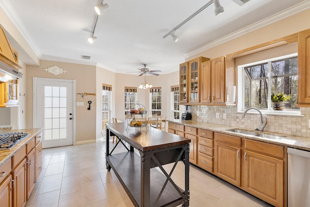 kitchen featuring appliances with stainless steel finishes, backsplash, a sink, and visible vents