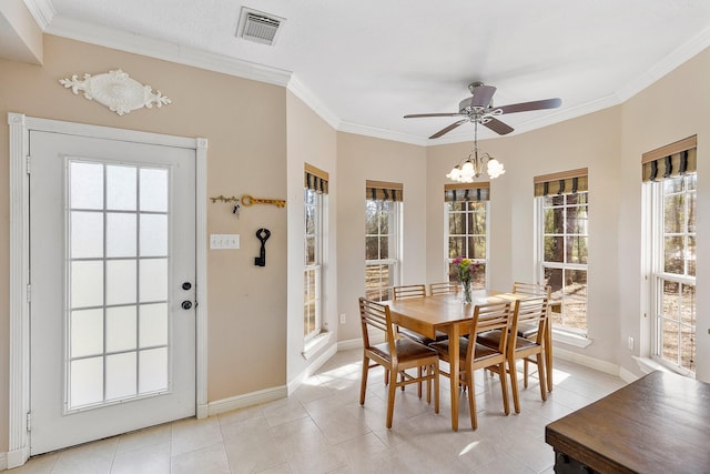 dining room with light tile patterned flooring, ceiling fan with notable chandelier, visible vents, baseboards, and crown molding