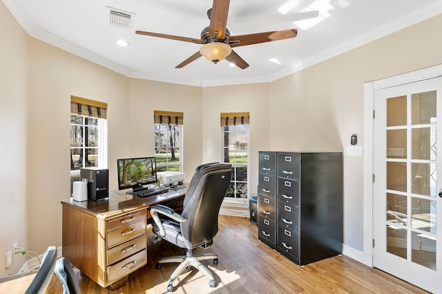 office area with visible vents, ornamental molding, a ceiling fan, wood finished floors, and baseboards