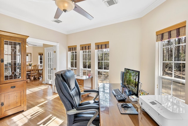 home office with visible vents, a ceiling fan, and french doors