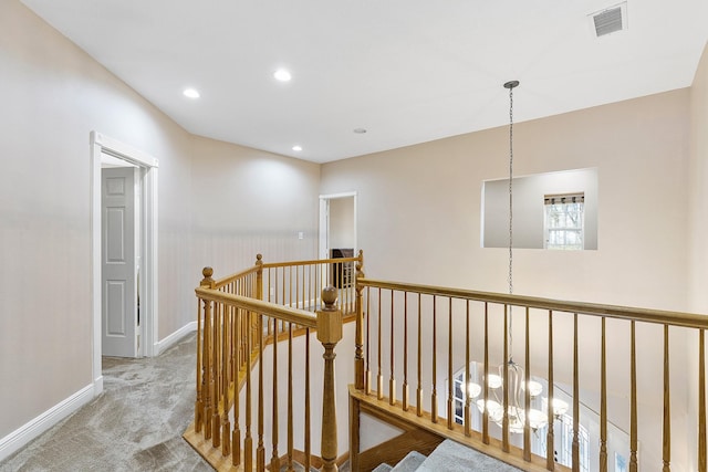 corridor with recessed lighting, carpet floors, an upstairs landing, baseboards, and visible vents