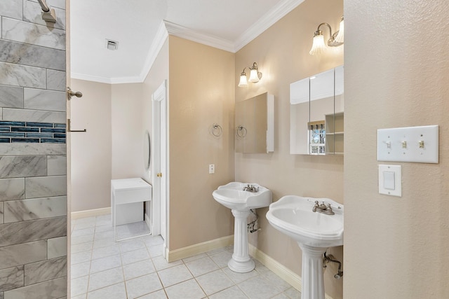 bathroom with baseboards, visible vents, ornamental molding, tile patterned floors, and a sink