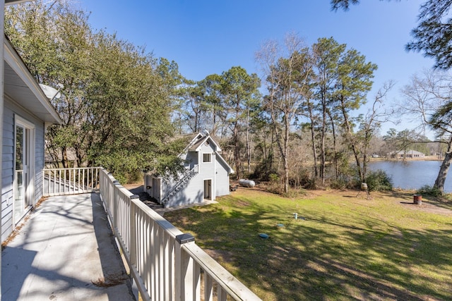 exterior space featuring a water view and fence