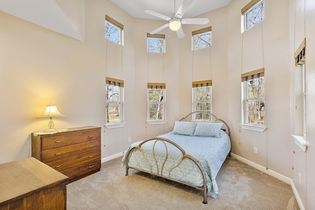 bedroom with carpet and multiple windows