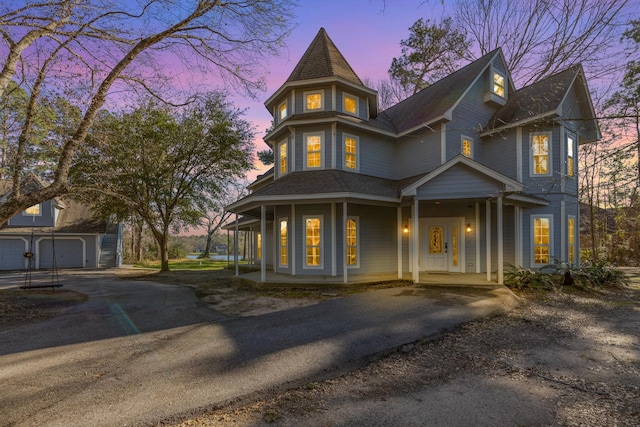 victorian-style house with aphalt driveway