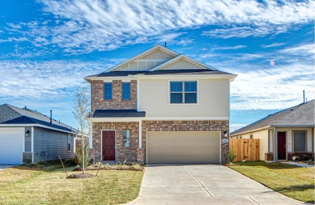 craftsman inspired home with a garage, brick siding, fence, driveway, and a front lawn