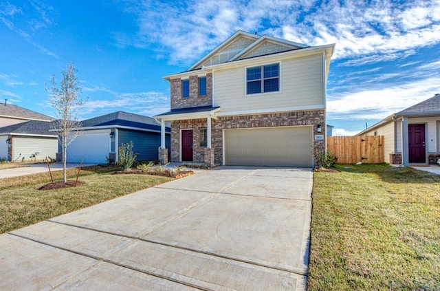 craftsman inspired home featuring a garage, fence, a front lawn, and concrete driveway