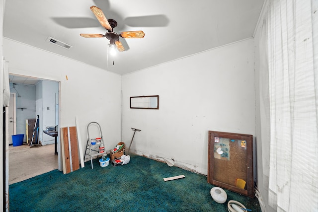 spare room featuring ceiling fan and visible vents