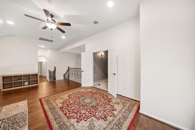 interior space with lofted ceiling, wood finished floors, visible vents, and recessed lighting