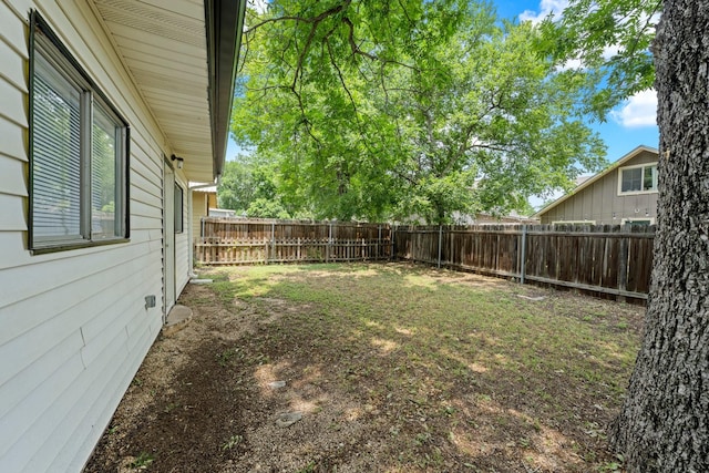 view of yard with a fenced backyard