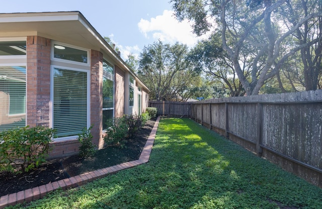 view of yard featuring a fenced backyard