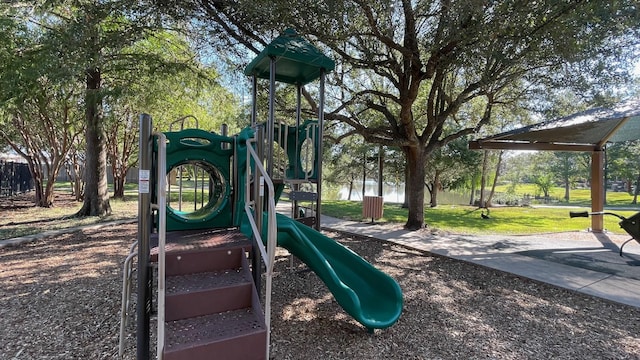 community jungle gym with a lawn