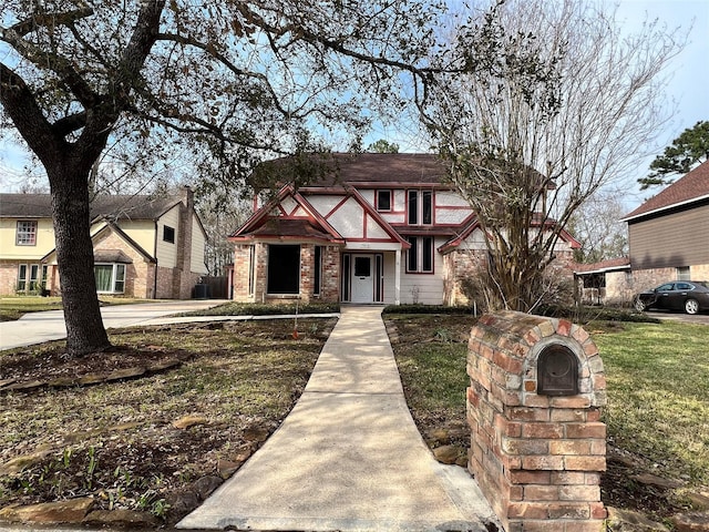 tudor home with brick siding