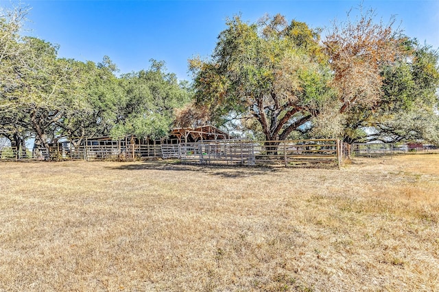 view of yard featuring an outdoor structure and an exterior structure