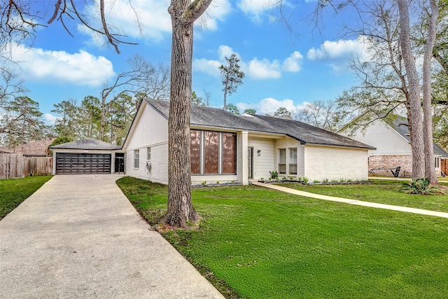 view of front of property with a garage, brick siding, an outdoor structure, fence, and a front lawn