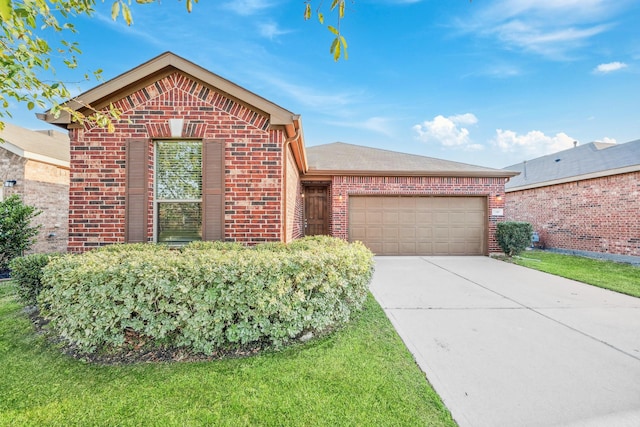 ranch-style house with an attached garage, a front lawn, concrete driveway, and brick siding