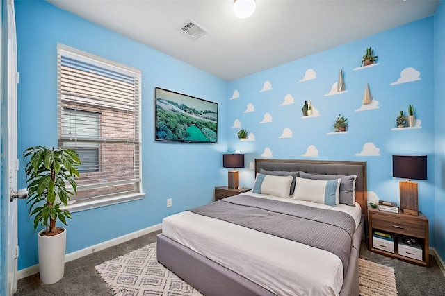 carpeted bedroom with visible vents and baseboards