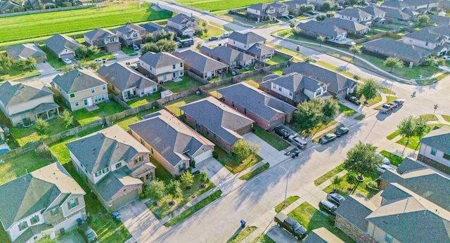 birds eye view of property with a residential view