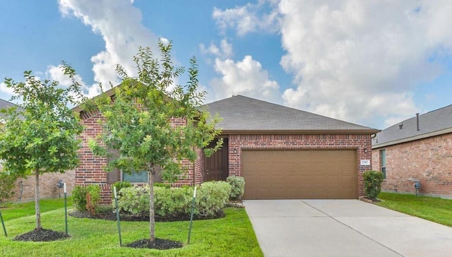 view of front of home featuring concrete driveway, brick siding, an attached garage, and a front lawn