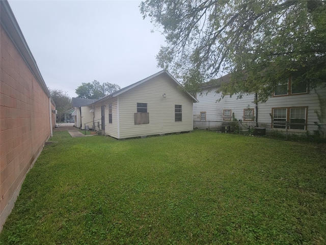 exterior space with a yard and fence