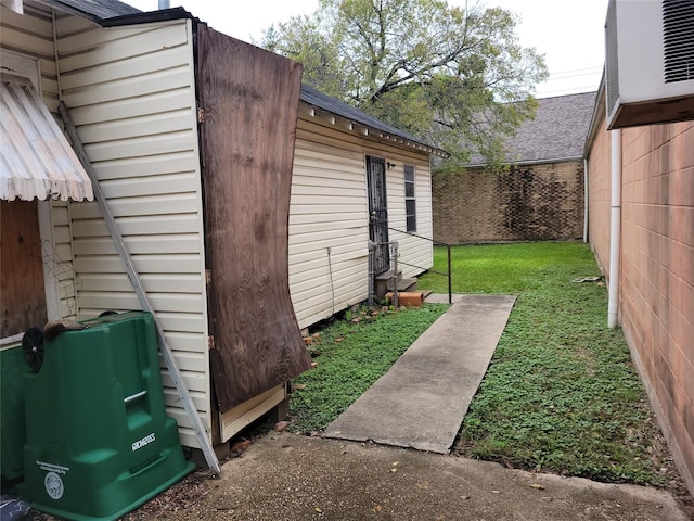 exterior space featuring entry steps and fence